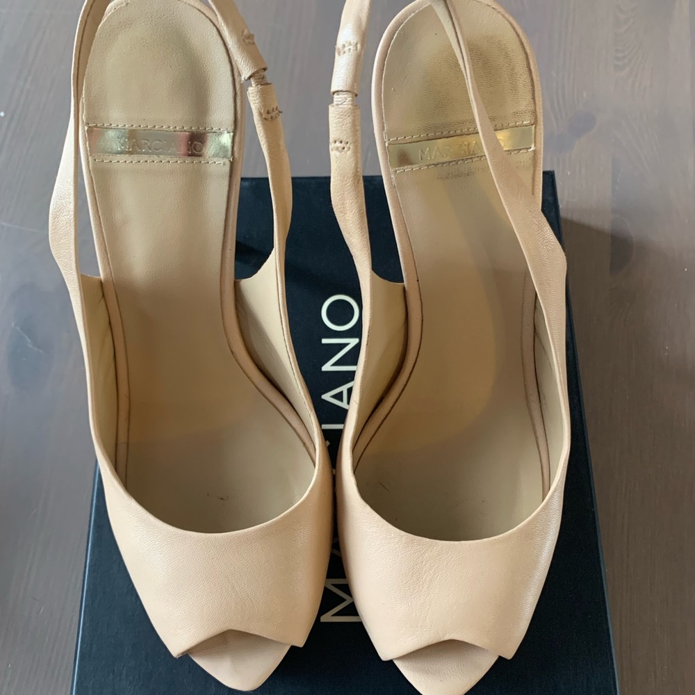 Marciano heels, Size 8, 4 inch heel (platform at the front). Only wore twice